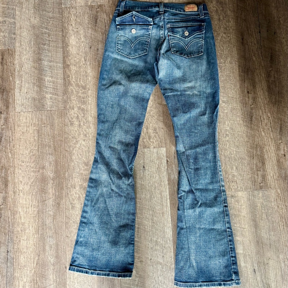 Vintage Levi’s 524 Too Superlow Button Flap Back Pockets w/ Button Closure Jeans